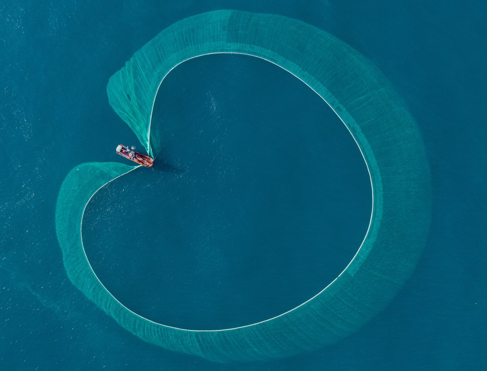 Aerial view of a fishing boat on the ocean, image credit: Pham Hung