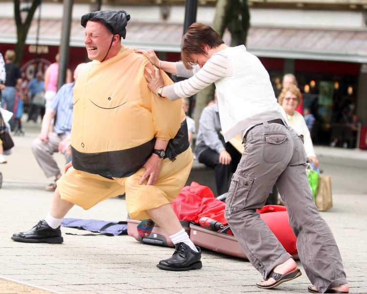David Price dressed as a sumo wrestler as part of his science made simple busking session held in Vicoria Sqaure in Bolton. 04/07/09